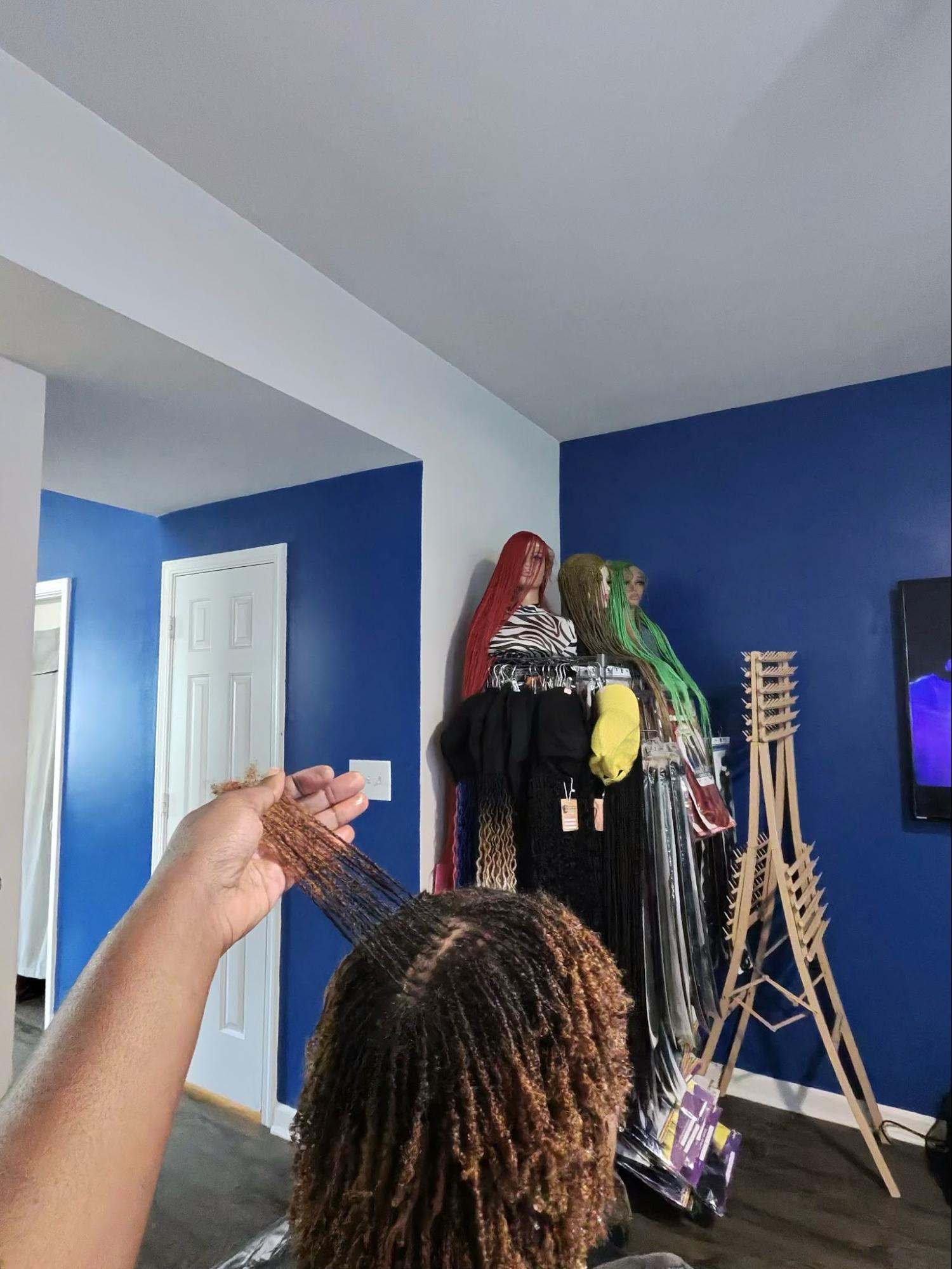 Microlocs being sectioned in a salon | Sisterloc Shop.