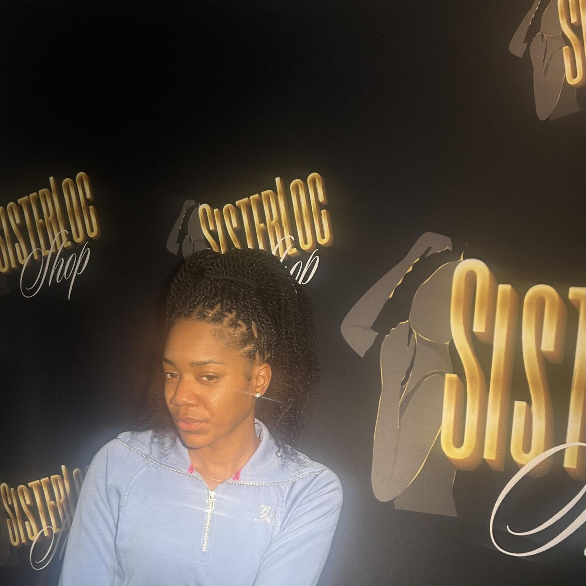 Woman with twisted locs ponytail | Sisterloc Shop .