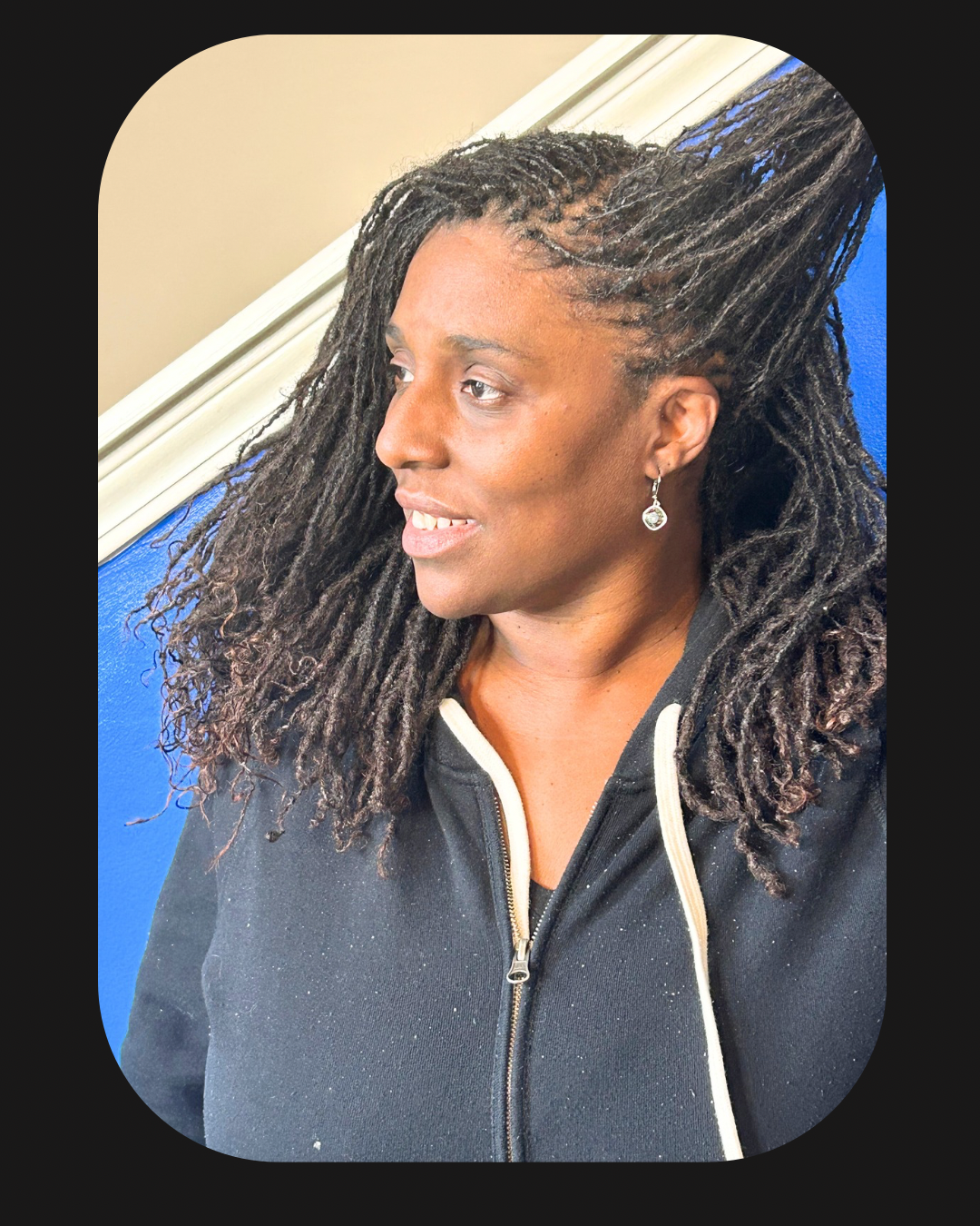Microlocks hairstyle on a smiling woman | Sisterloc Shop .